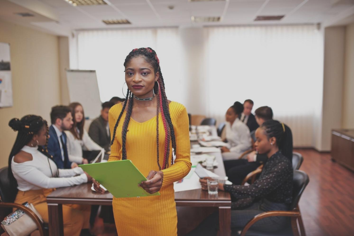 Study materials and investment books arranged on desk with notes and research documents